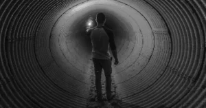 Person feeling lost in a dark tunnel of wrong career paths 